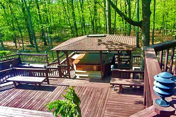 All-in-One Pocono Vacation House deck and hot tub
