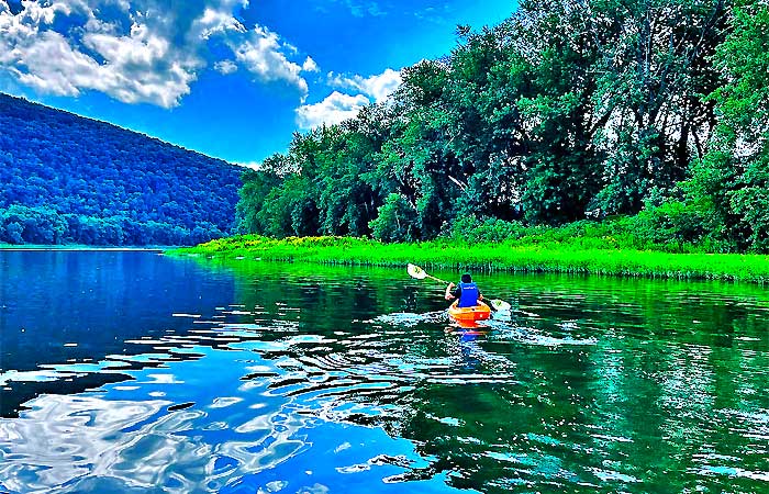 Belhana by the River Man in Kayak