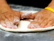 Brothers Pizzeria rolling the dough