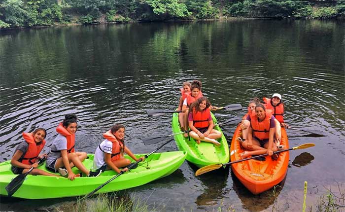 CGI Camp Gan Israel girls on lake in kayaks
