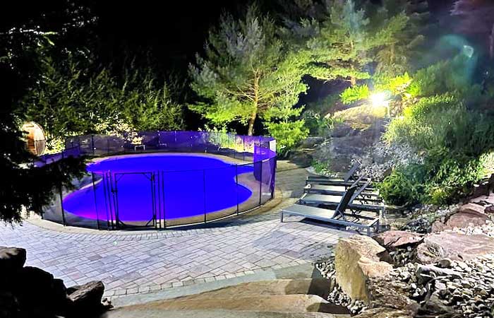 Cabin in a Rugged Rock Space Pool at Night
