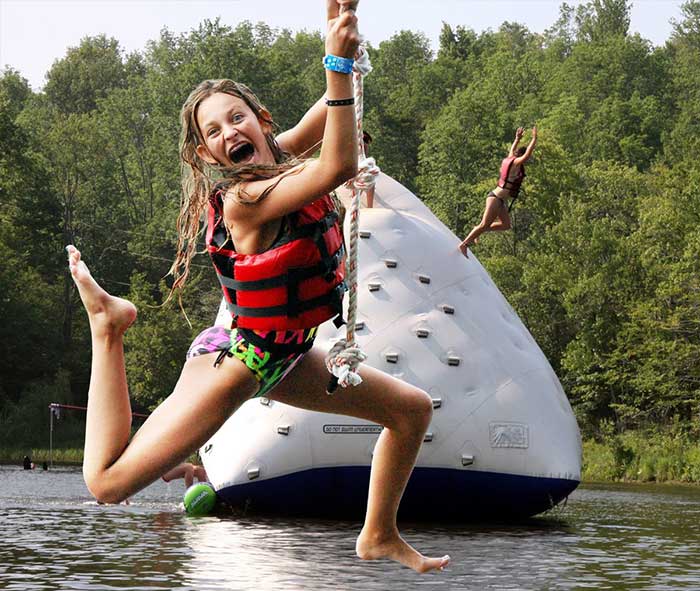 Camp-Lohikan-girl-on-rope-swing