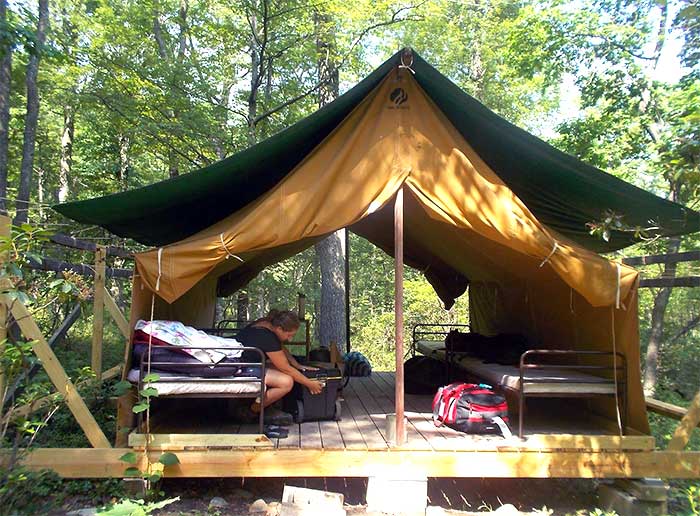 Camp-Mosey-Wood-Girl-Scout-Camp-girl-in-platform-tent
