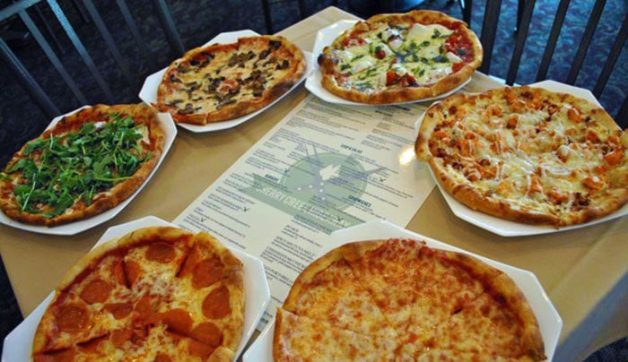 assortment of pizzas