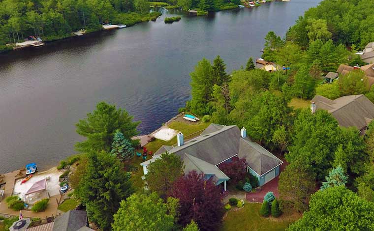 Grand Slam House view of lake from behind the house