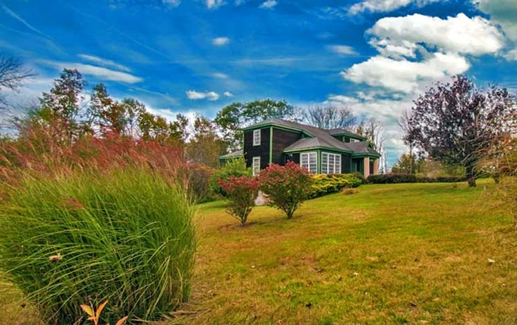 Hilltop Lodge exterior and garden