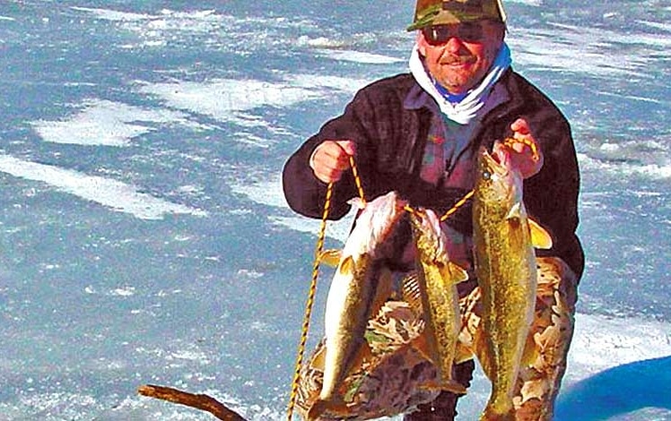 Ice Fishing Lake Wallenpaupack man with his fish catch