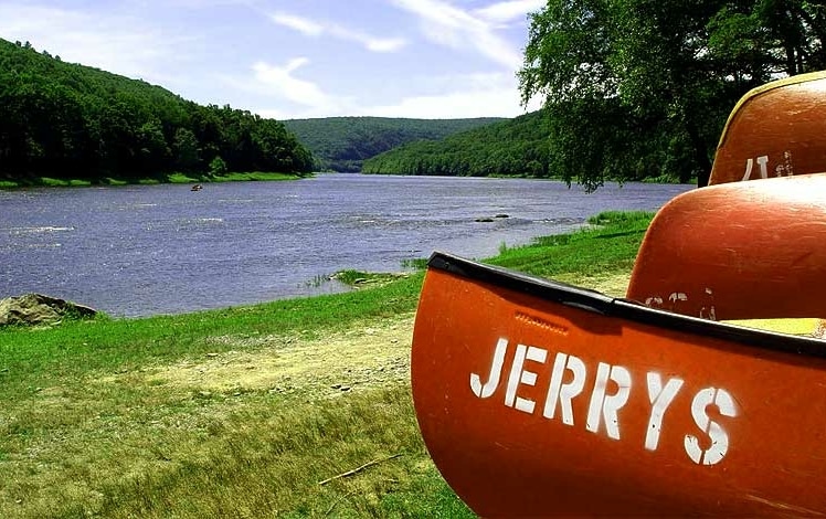 Jerry's Three River Campground canoes on river shore