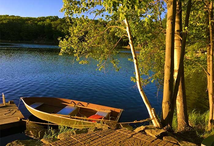 lakefront house on deer lake canoe on shore