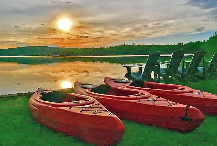 Lakefront Rustic Cabin kayaks on the lake shore