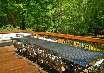 Large Modern Cabin with Hot Tub outdoor dining table on deck
