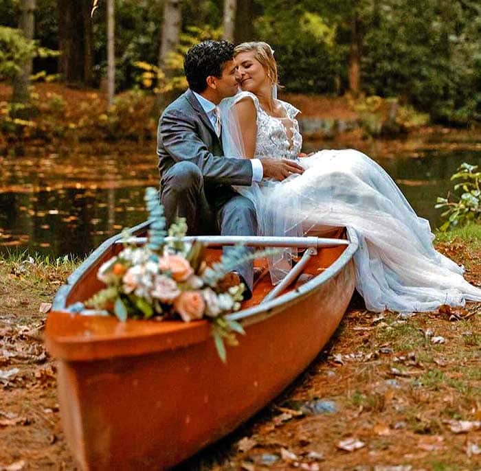 Magnolia Streamside Resort Wedding couple in a canoe