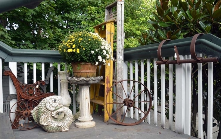 Old Lumberyard Antiques porch with wagon wheel