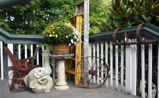 Old Lumberyard Antiques porch with wagon wheel