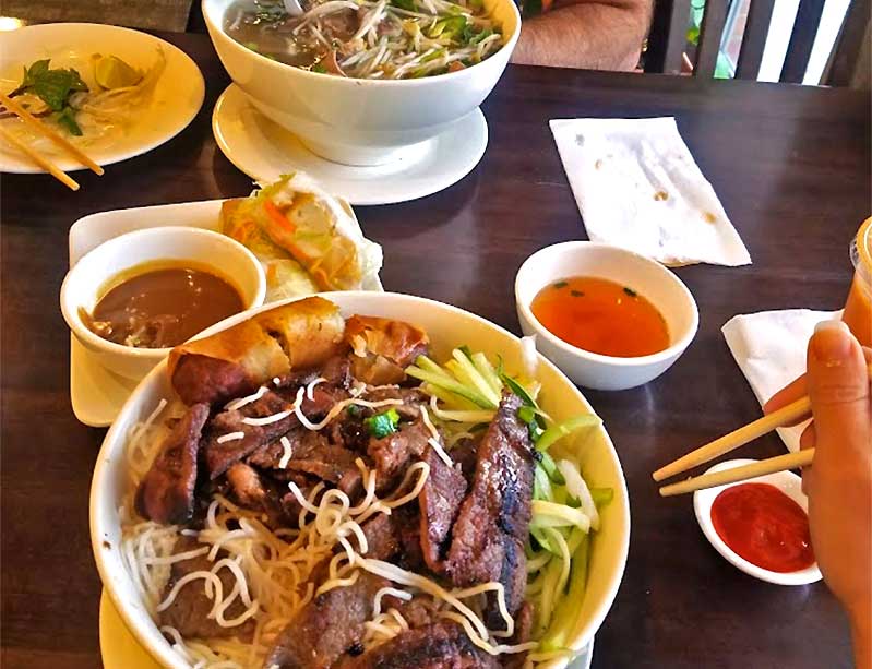 Pho Saigon II table of dishes of food