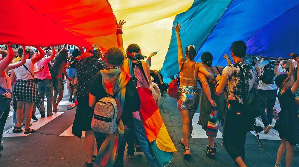 event Pocono Pride Festival 2022 people with rainbow flag