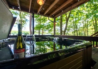 red canoe lakefront hot tub on deck