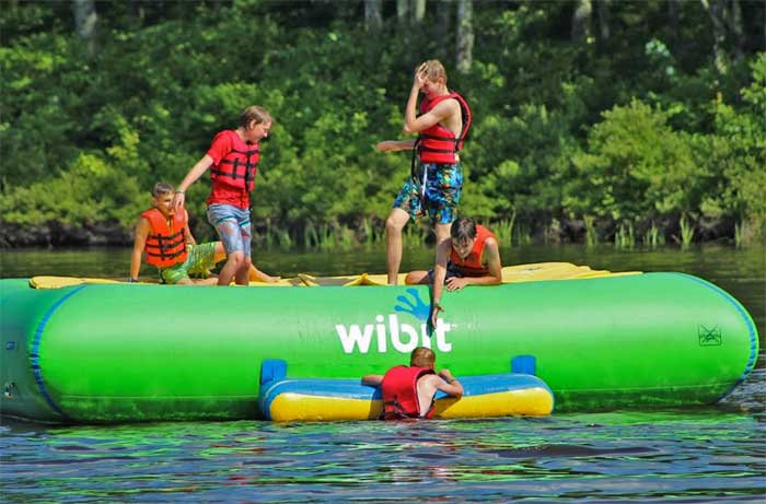 kids on float on lake rogers