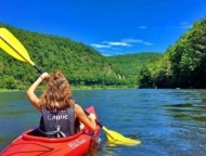 Silver Canoe & Whitewater Rafting girl in kayak on river