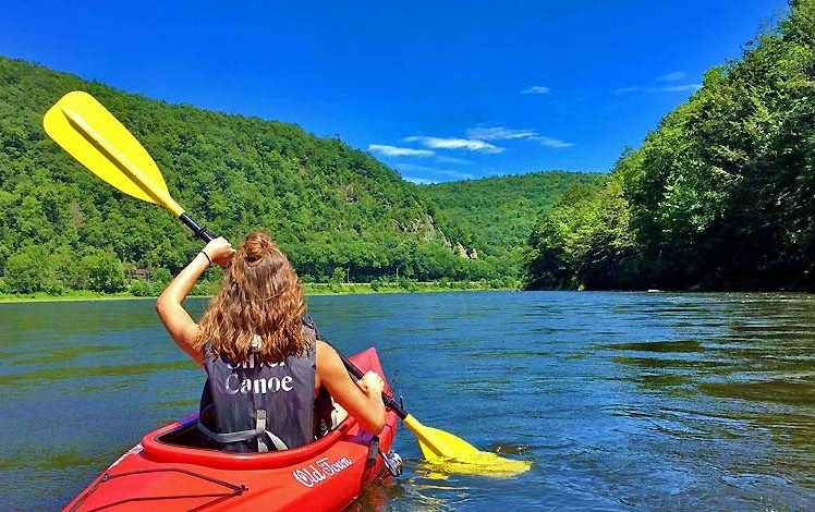 Silver Canoe & Whitewater Rafting girl in kayak on river