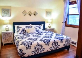 Skylark Cabin blue room with king bed