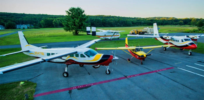 trio of planes parked on the tarmac