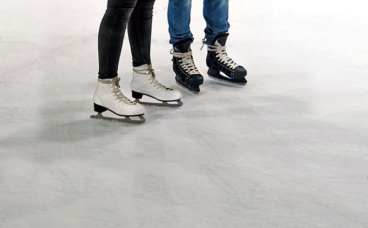 skytop lodge skating couples with skates on ice
