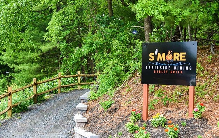 S'more Trailside Dining sign on the trail