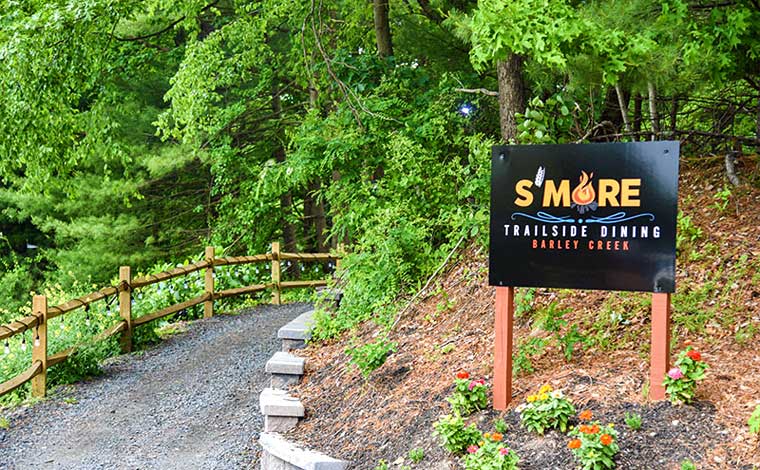 S'more Trailside Dining sign on the trail