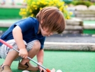 Snydersville Mini-Golf child on the course