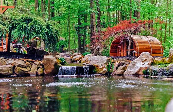 Spa Inspired Woodlands House sauna on the pond