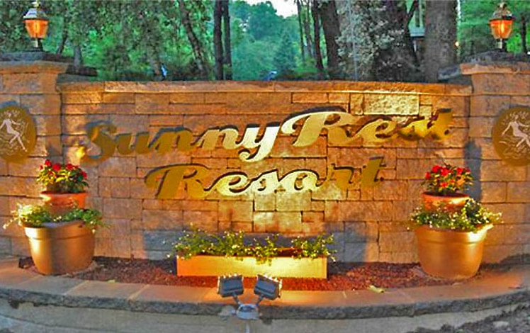 sunny rest resort entrance sign
