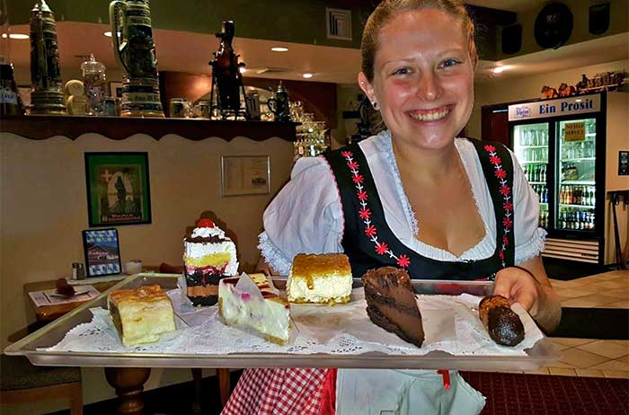 The Alpine Wurst and Meat House girl with dessert tray