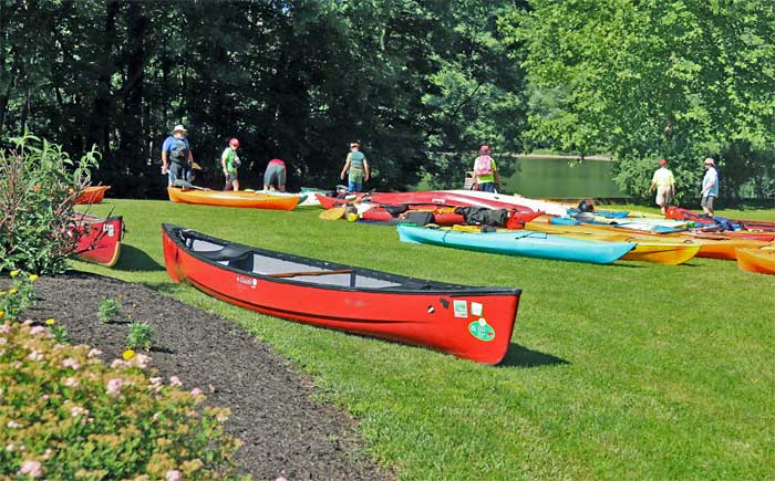 The Delaware River Sojourn kayaks in the grass