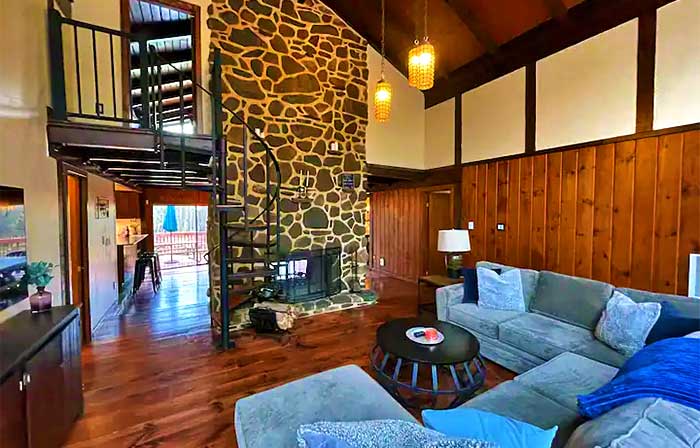 The Kings Cabin Living Room and Floor to Ceiling Fireplace
