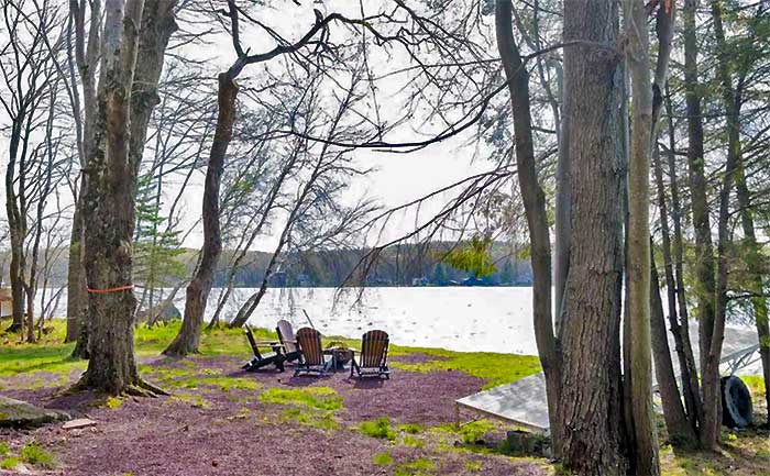 The Pines Lakefront Arrowhead fire pit at lake