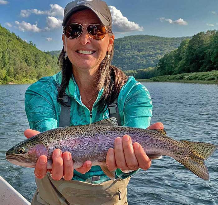 Whitetail Country Fly Shop and Outfitter woman with fish catch