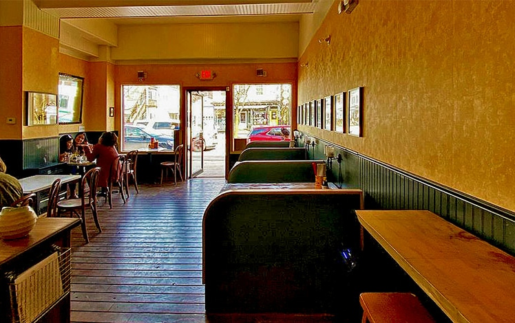 interior of restaurant wiht tables and booths