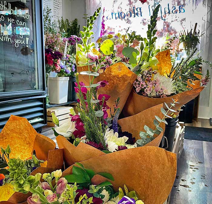 shop interior with flower bundles on shelves