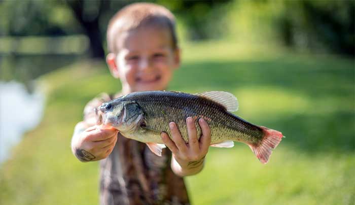 big-brown-fish-&-pay-lakes-child-holding-fish