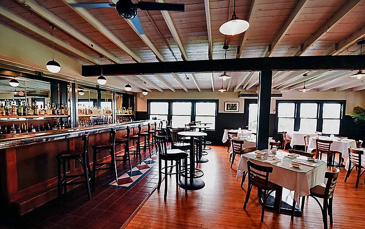 dining room bistro at rainbow mountain exposed beams and white tablecloths