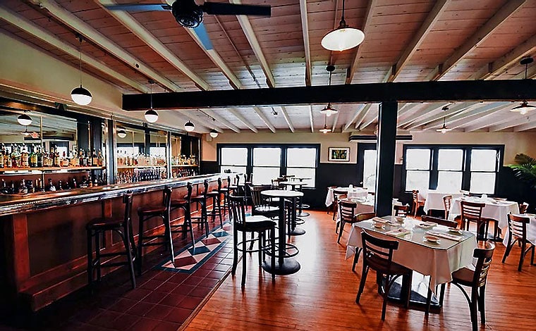 dining room bistro at rainbow mountain exposed beams and white tablecloths