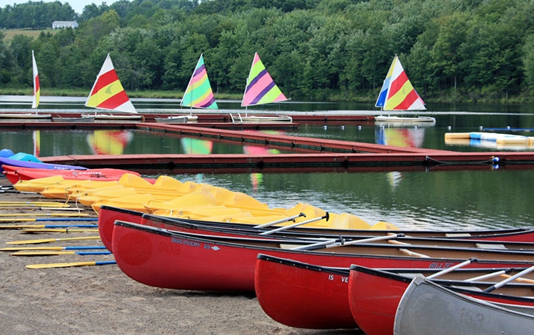 camp-cayuga-canoes-and-sailboats-on-the-lake