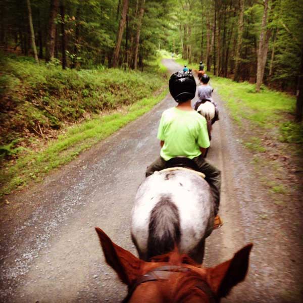 camp-shohola-for-boys-riding-horses-on-trail