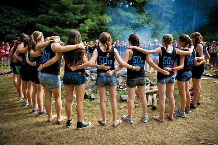 camp-timber-tops-girls-around-the-campfire