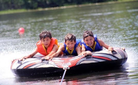 chesnut lake camp boys in tube raft