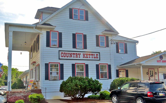 exterior of country kettle giant old white house