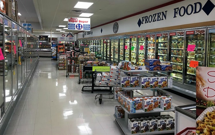 inside of dave's super duper supermarket frozen food aisle