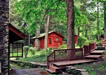 cabins and a wooden walkway up the hill