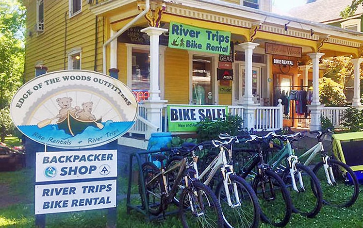 yellow victorian house with bikes